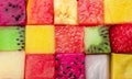 Fruit puzzle. Colorful food background or pattern arranged of different fruit cubes. Dietary concept Royalty Free Stock Photo