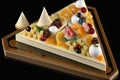 fruit pyramids in cream decoration tyrolean pie Royalty Free Stock Photo