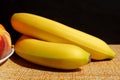 Fruit ripe two bananas lie on the table Royalty Free Stock Photo
