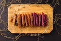 fruit rolls on a wooden board on a black background. Useful sweets. Proper nutrition.