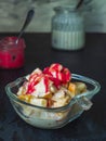 Fruit salad with adding raspberry honey and yogurt in a glass bowl Royalty Free Stock Photo