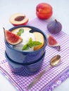 Fruit salad. Assorted purple fruits in a blue bowl. Healthy eating concept. Royalty Free Stock Photo