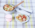 Fruit salad in a ceramic bowl, yogurt.