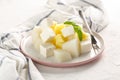 Fruit salad with cheese. Mango, melon with cheese and Basil Royalty Free Stock Photo
