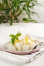 Fruit salad with cheese. Mango, melon with cheese and Basil Royalty Free Stock Photo