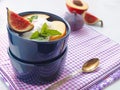 Fruit salad with cream close up. Summer fruits mix upon light grey wooden table. Royalty Free Stock Photo