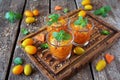 Fruit salad dessert with carrot, orange and mint in glasses Royalty Free Stock Photo