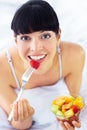 Fruit salad, eating or portrait of happy woman with a morning breakfast or lunch diet in home. Smile, gut health or Royalty Free Stock Photo