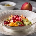 fruit salad with exotic fruits in a porcelain bowl