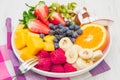 Fruit salad with fresh berries, orange, coconut, mango, and sliced of banana Royalty Free Stock Photo