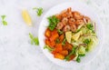 Fruit salad with fried prawns / shrimps, persimmon, red onion and lettuce in white bowls. Royalty Free Stock Photo