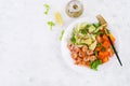 Fruit salad with fried prawns / shrimps, persimmon, red onion and lettuce in white bowls. Royalty Free Stock Photo