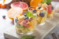 Fruit salad in glasses,  fresh summer foods , healthy organic orange kiwi blueberries pineapple coconut Royalty Free Stock Photo