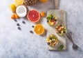 Fruit salad in glasses,  fresh summer foods , healthy organic orange kiwi blueberries pineapple coconut. top view Royalty Free Stock Photo