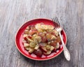 Fruit salad of grapes, bananas and apples with poppy seeds and honey Royalty Free Stock Photo