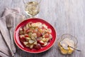 Fruit salad of grapes, bananas and apples with poppy seeds and honey Royalty Free Stock Photo