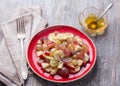 Fruit salad of grapes, bananas and apples with poppy seeds and honey Royalty Free Stock Photo