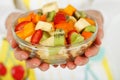 Fruit salad in the hands Royalty Free Stock Photo