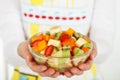 Fruit salad in the hands Royalty Free Stock Photo