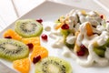 Fruit salad with ice cream on a white plate Royalty Free Stock Photo