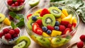 fruit salad kiwi, apple, mango summer , summer strawberries nutritive glass dessert bowls, in the kitchen healthy