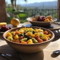 Fruit salad in a large ceramic serving bowl