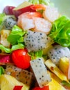 Fruit salad mixed with vegetables and sesami soy sauce gravy Royalty Free Stock Photo