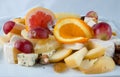 Fruit salad with nuts, raisins and cheese. Royalty Free Stock Photo