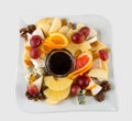 Fruit salad with nuts, raisins and cheese. Royalty Free Stock Photo