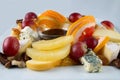 Fruit salad with nuts, raisins and cheese. Royalty Free Stock Photo