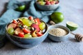 Fruit salad with quinoa, strawberry, peach, white grapes, plums, mint and honey lime dressing