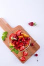 Fruit salad of strawberries, kiwis and apricots. Fresh and tasty snack Top view, place for text
