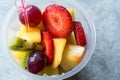 Fruit Salad with Strawberry, Kiwi, Mango and Grape in Plastic Cup. Royalty Free Stock Photo