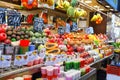 Fruit Salad and tropical fruits arranged in plastic cups on a market stall