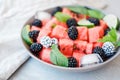 Fruit salad from Watermelon slices, frozen blackberry and lime o Royalty Free Stock Photo