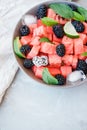 Fruit salad from Watermelon slices, frozen blackberry and lime o Royalty Free Stock Photo