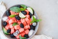 Fruit salad from Watermelon slices, frozen blackberry and lime o Royalty Free Stock Photo