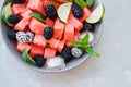 Fruit salad from Watermelon slices, frozen blackberry and lime o Royalty Free Stock Photo