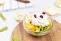 Fruit salad whipped cream flat lay white marble table Royalty Free Stock Photo