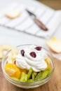 Fruit salad whipped cream flat lay white marble table Royalty Free Stock Photo