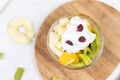 Fruit salad whipped cream flat lay white marble table Royalty Free Stock Photo