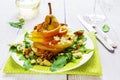 Fruit salad, whole pear sliced, walnuts caramelized in honey, blue cheese and arugula.