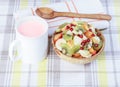 Fruit salad in a wooden bowl, yoghurt. Royalty Free Stock Photo