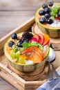 Fruit salad with yogurt in carved melon cantaloupe bowl Royalty Free Stock Photo