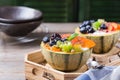 Fruit salad with yogurt in carved melon cantaloupe bowl Royalty Free Stock Photo