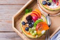 Fruit salad with yogurt in carved melon cantaloupe bowl Royalty Free Stock Photo