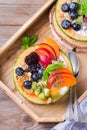 Fruit salad with yogurt in carved melon cantaloupe bowl Royalty Free Stock Photo