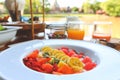 fruit salad with yogurt on table ready for breakfast Royalty Free Stock Photo