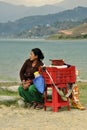 Seller of fruit with scales in the streets of Pokhara Royalty Free Stock Photo