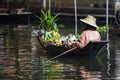 Fruit seller sailing boat in dumneon saduak floating market ratchaburi thailand